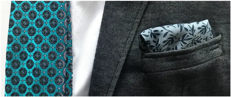 A white pocket square on blue flowers with blazer