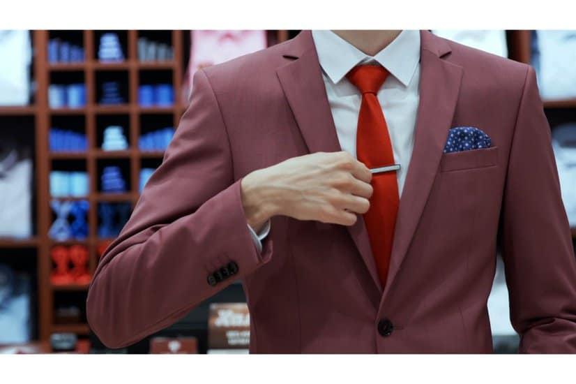 Close up of businessman try on red neckties