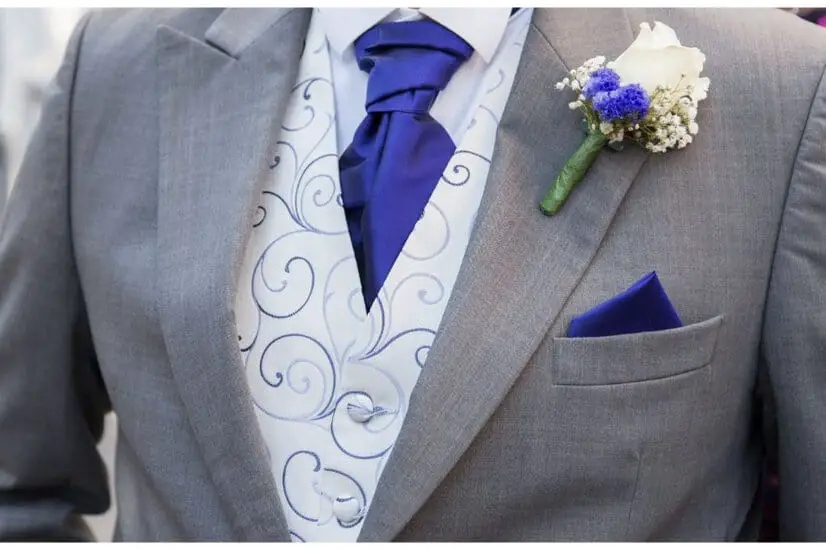 groom in suit with blue necktie