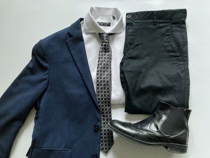 Blue blazer with black pants, a white shirt, a tie and leather shoes