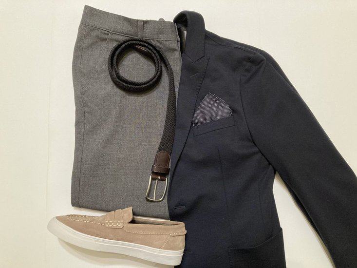 Navy blue blazer and light gray pants