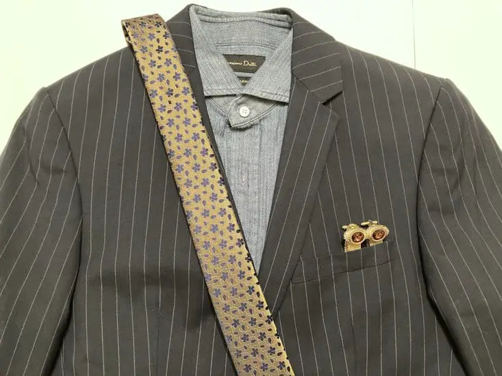 blazer with gold cufflinks