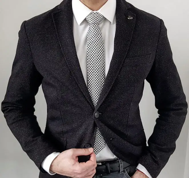 gray blazer with a pair of slim fit chinos