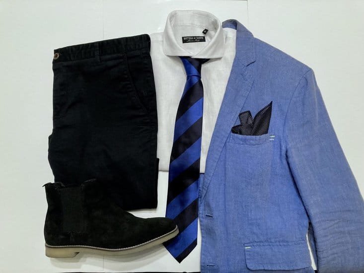 white shirts, light blue blazer and black pant with black boots
