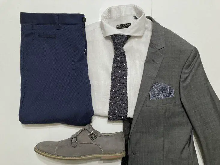 gray blazer with a white dress shirt and navy trouser
