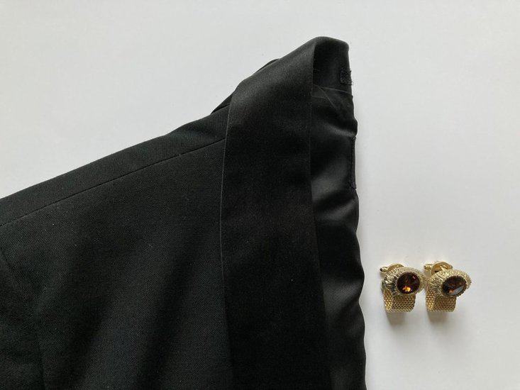 Black blazer with golden cufflinks 