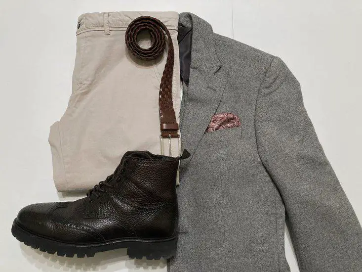 gray blazer with dark brown leather boots