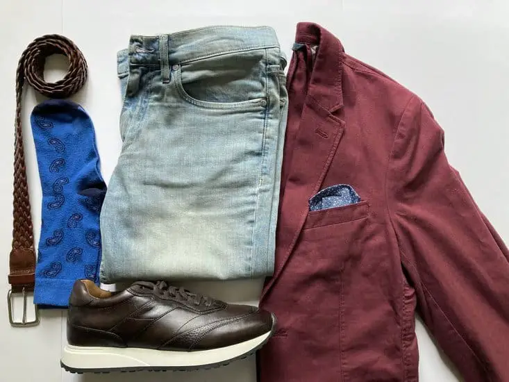 Maroon blazer with some light blue jeans and brown sneakers
